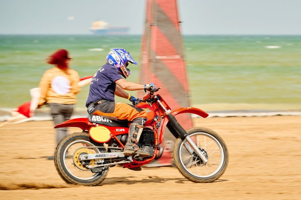 Dynamic capture of a motorcycle race on the sandy shores of Margate Beach, UK.